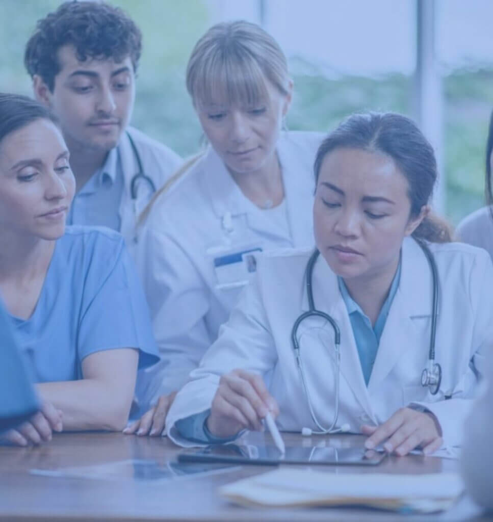A female doctor is leading the meeting.