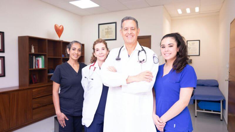 Group of diverse healthcare professionals in a clinical setting.
