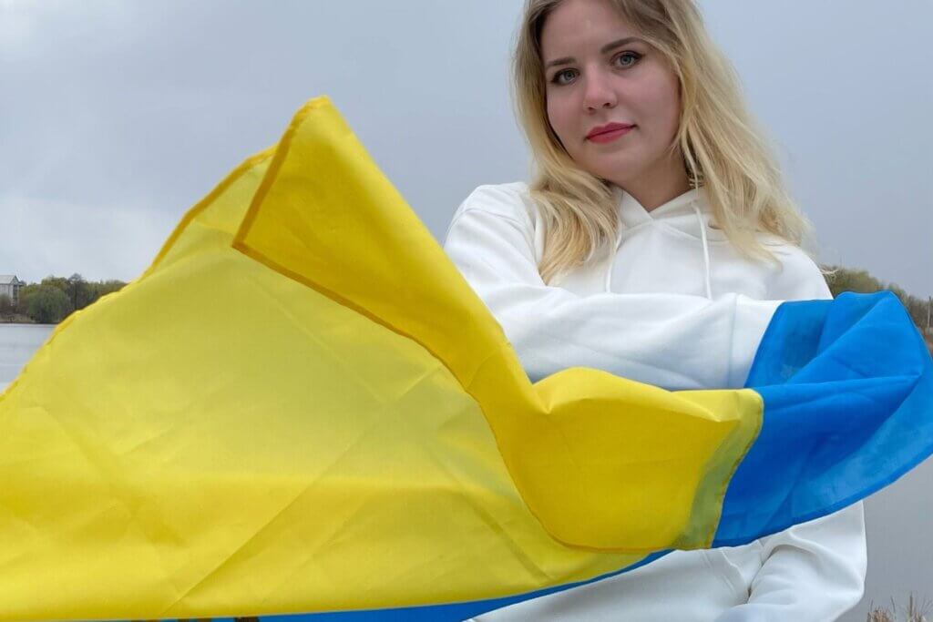 Ukrainian nursing student preparing NCLEX application documents and study notes