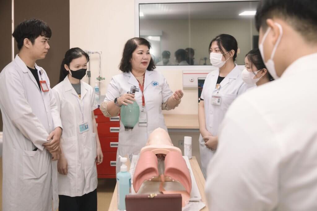 Filipino nurse creating an NCLEX study plan with laptop notes and calendar